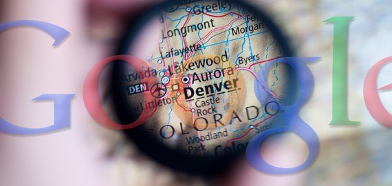Google logo over map with magnifying glass