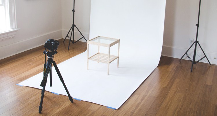 e-commerce photography of end table with sloped construction paper